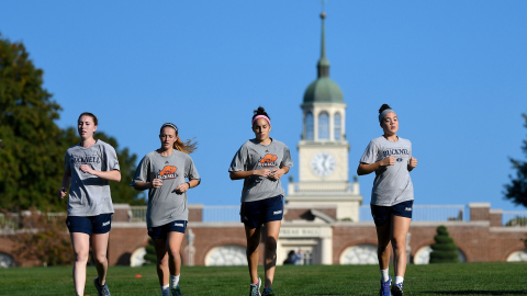 Students running on campus