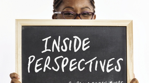 Person holding up chalkboard saying inside perspectives