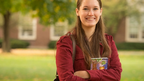 Woman standing with her book