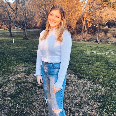 Emma Davison '23 stands outside.