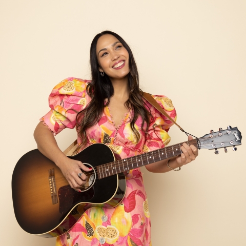 Sonia De Los Santos playing a guitar