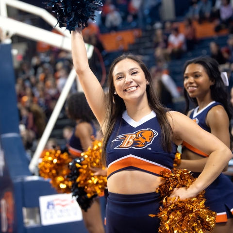 Faith Trejo cheers at a basketball game.