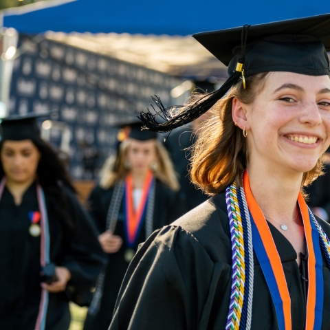 Graduates process into Commencement