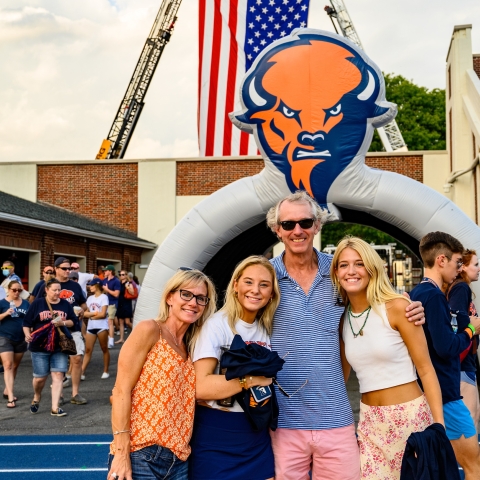 Family at football game during Family Weekend