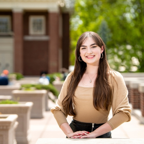 Susie Williams stands on the Quad