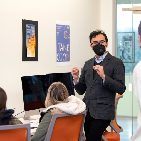 Student wearing a black mask for Covid-19 protection.