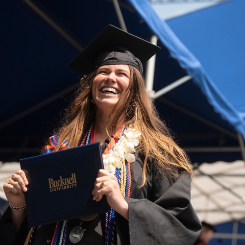 Graduate happily walks across stage