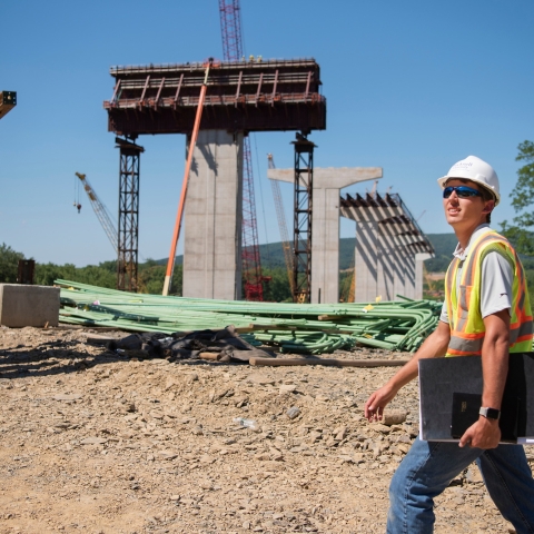 Student bridge construction intern on site