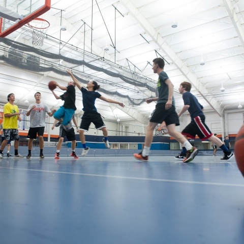 Students play basketball