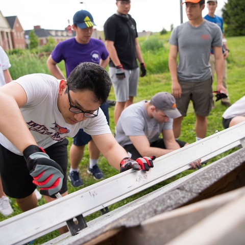 Students help install solar panels