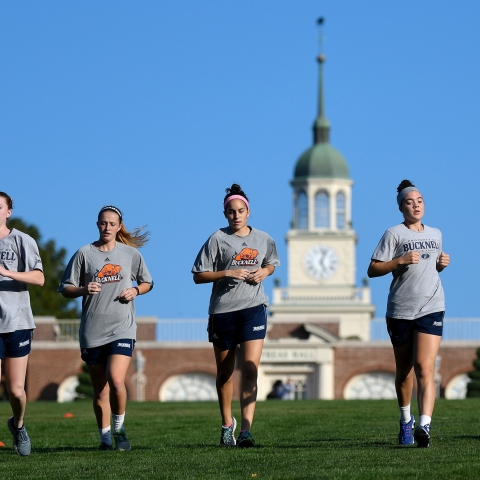 Students running on campus