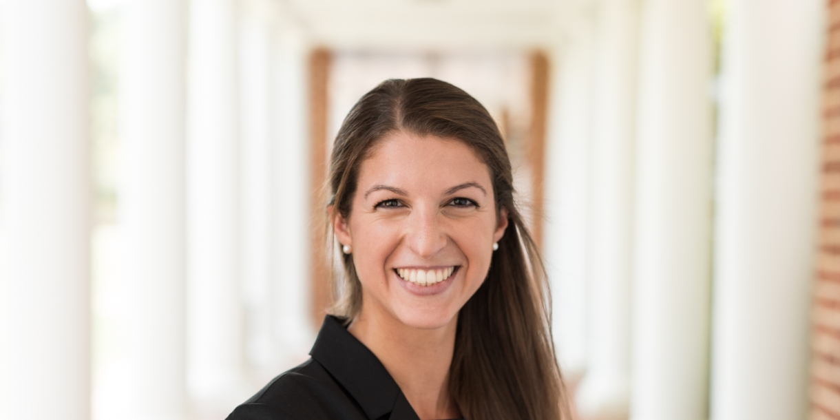 Rachel Gibson poses under a colonnade on the University of Virginia campus