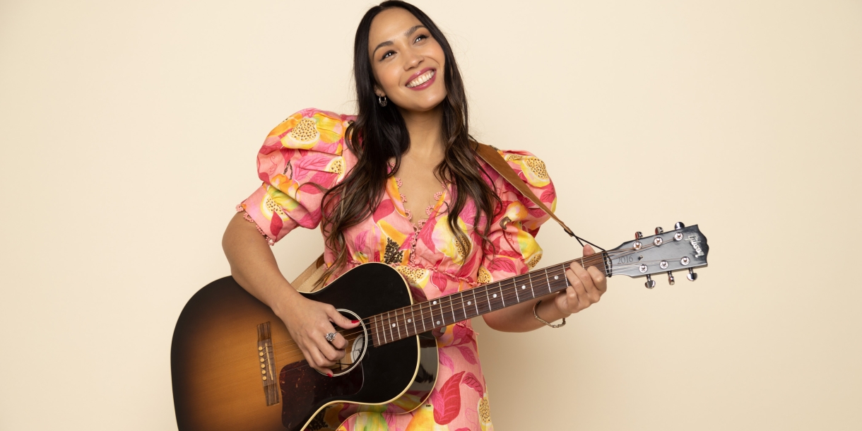 Sonia De Los Santos playing a guitar