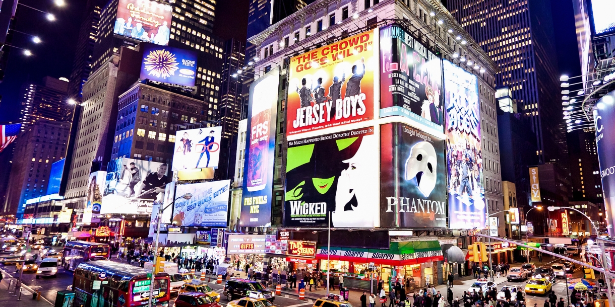 Broadway in New York City lights up at night