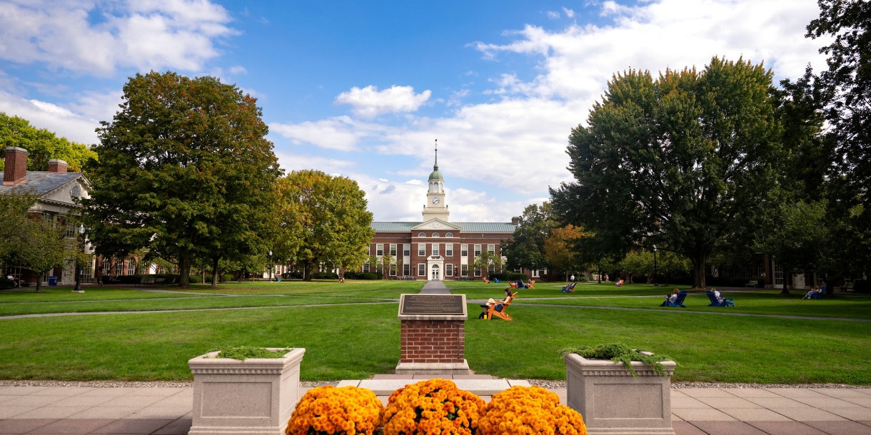 View of Malesardi Quad with dedication plaque and Bertrand Library in fall