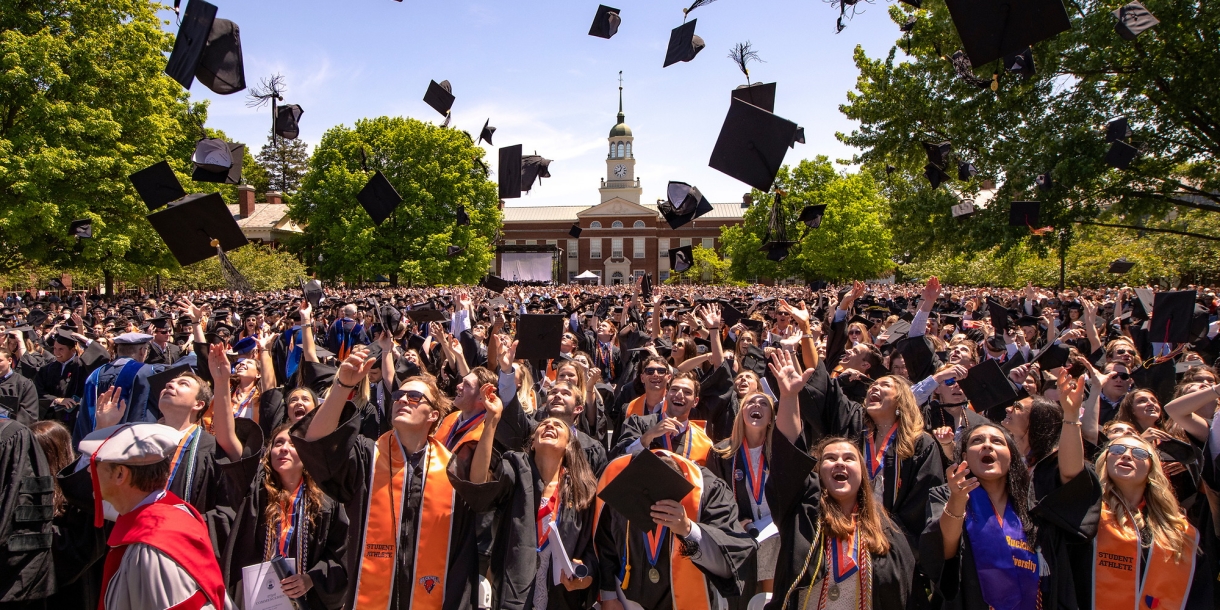 Hundreds of graduates on Malesardi Quadrangle throw their caps to celebrate their commencement