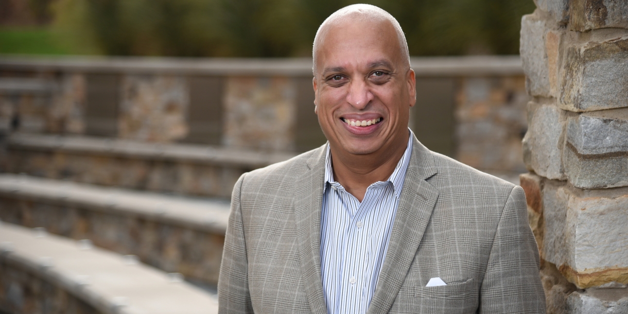 Frank Davis ’82 near the building named in his honor.
