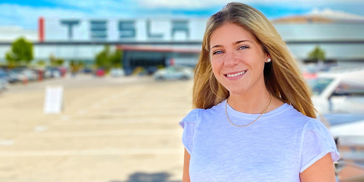 Caitlin D'Abrosio outside Tesla's Silicon Valley headquarters