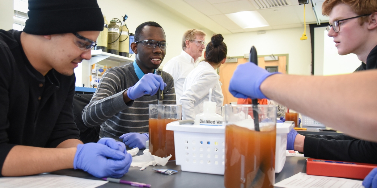 Res College students in water purification lab