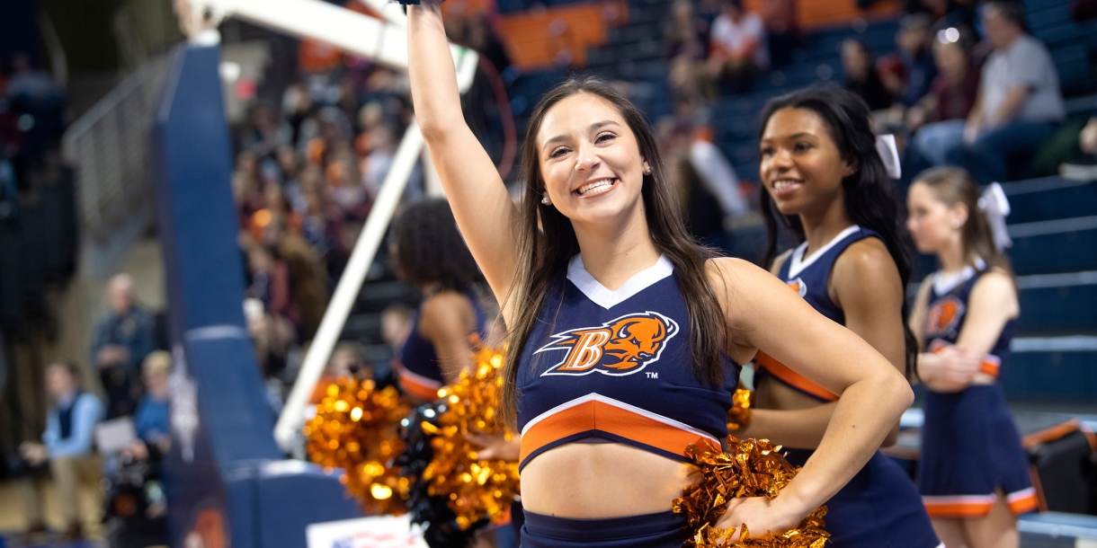 Faith Trejo cheers at a basketball game.