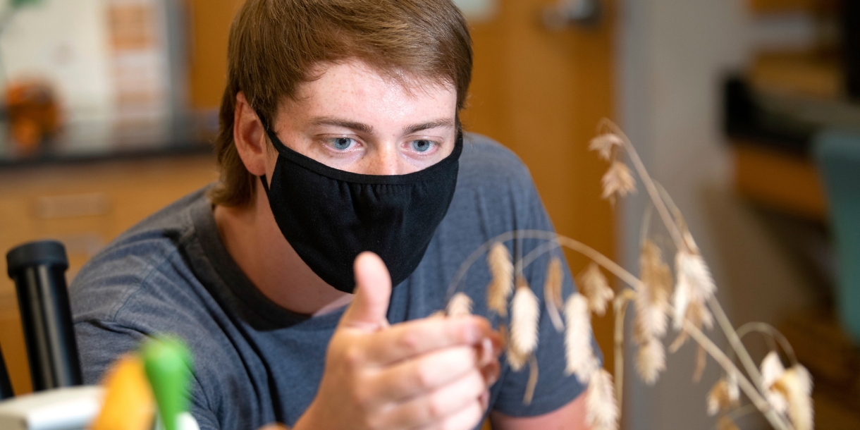 Portrait of student Jon Hayes in Herbarium