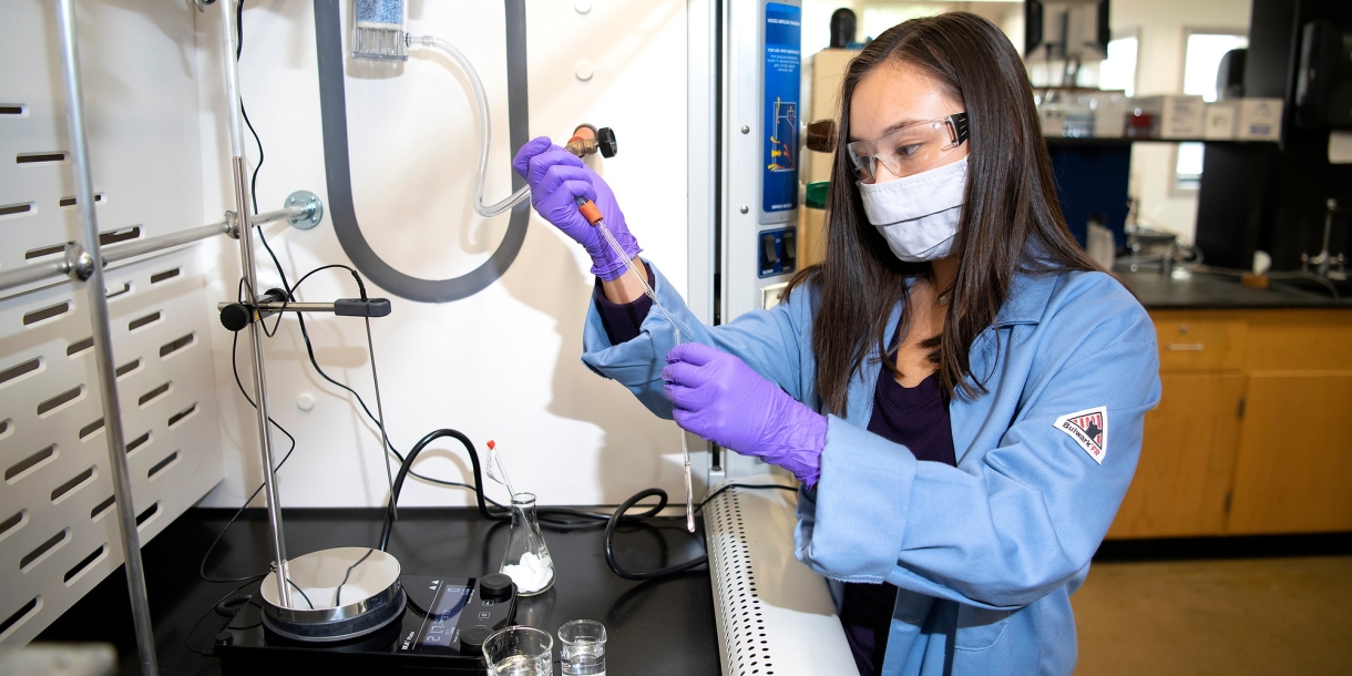 Mikayla performs an experiment in a lab