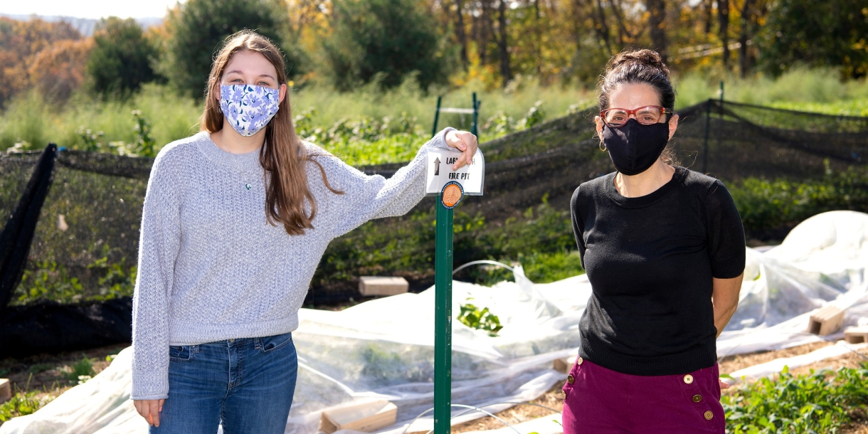 Riley Doyle and Deborah Sills with ag plastic at The Bucknell Farm.