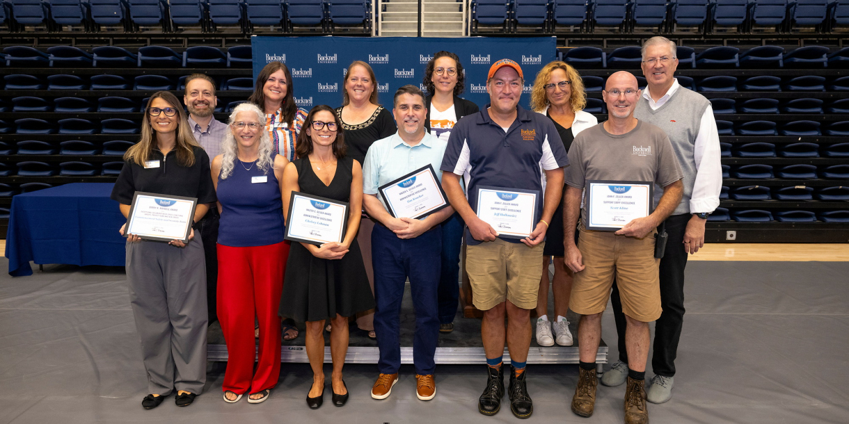 A group of Bucknellians stand together after receiving awards.