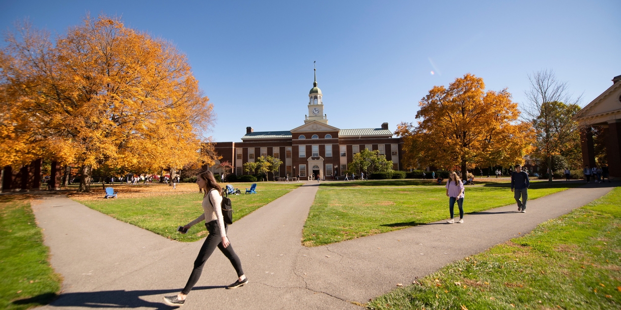 Students walk on Malesardi Quad in front of Bertrand Library in the fall.