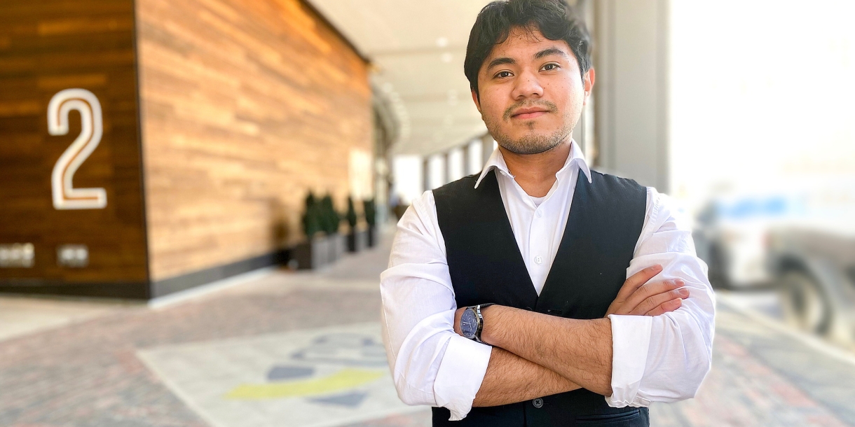 Manuel Teshe '23 poses outside building