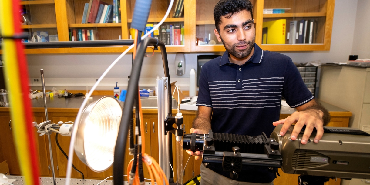 Abdullah Nabi in a mechanical engineering lab with research equipment