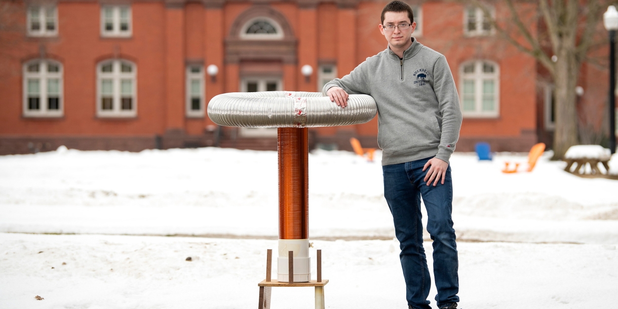 David Berry stands outside with his musical Tesla coil