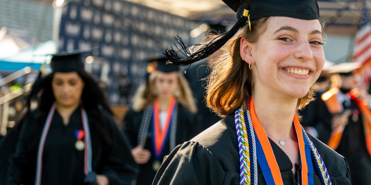 Graduates process into Commencement