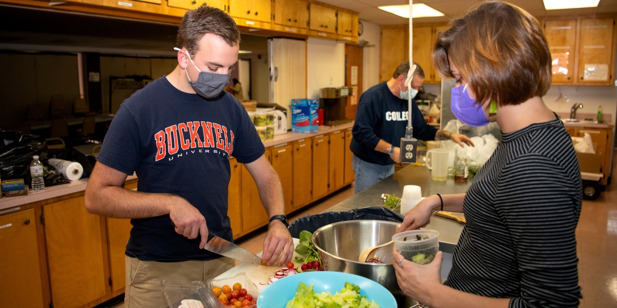 Paul Danenberg preparing food at Community Harvest in Milton