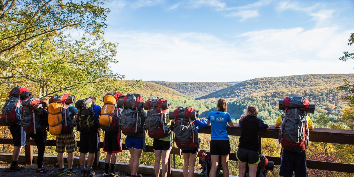 Students with backpacks on BuckWild trip