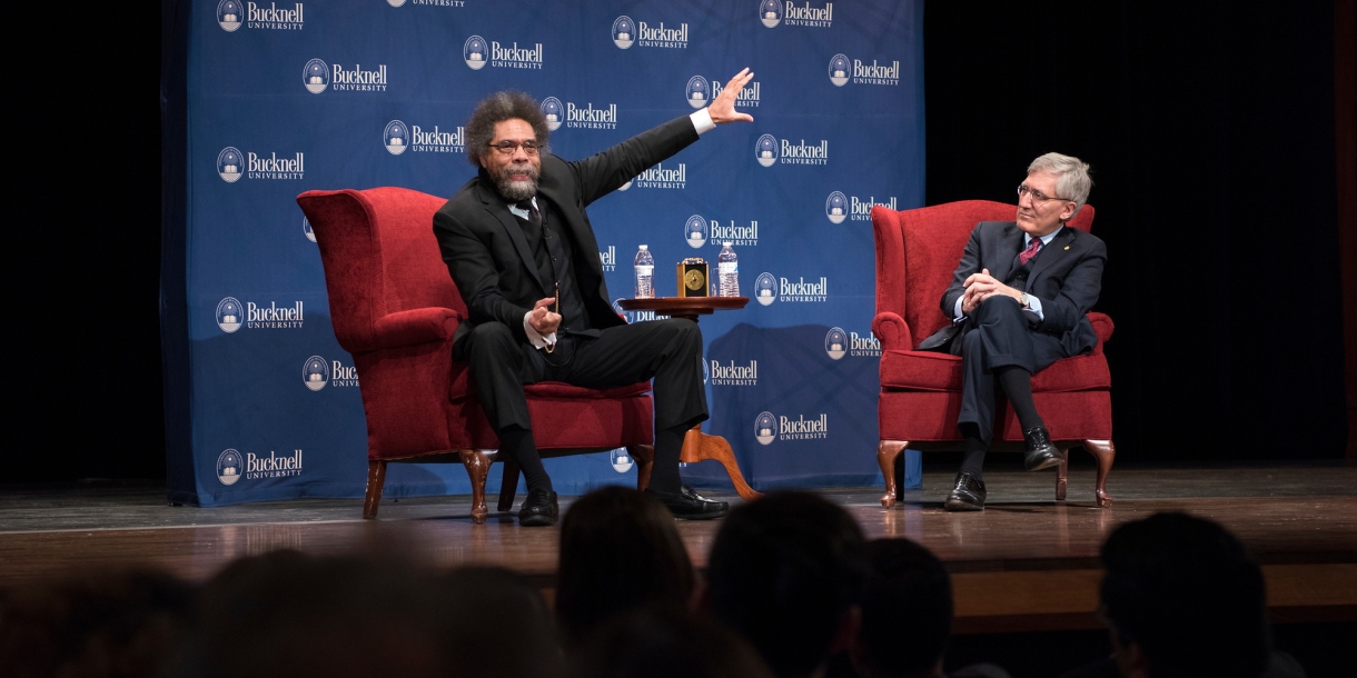 Cornel West and Robert George speaking at the Weis Center