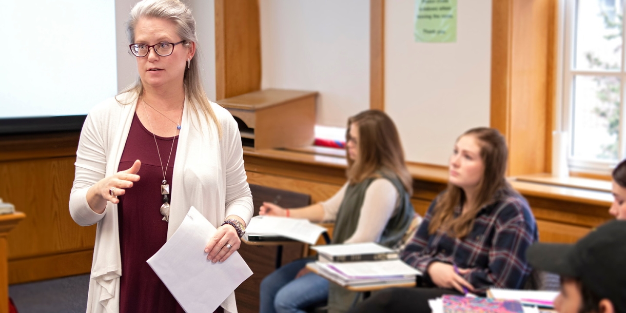 Professor standing in middle of classroom