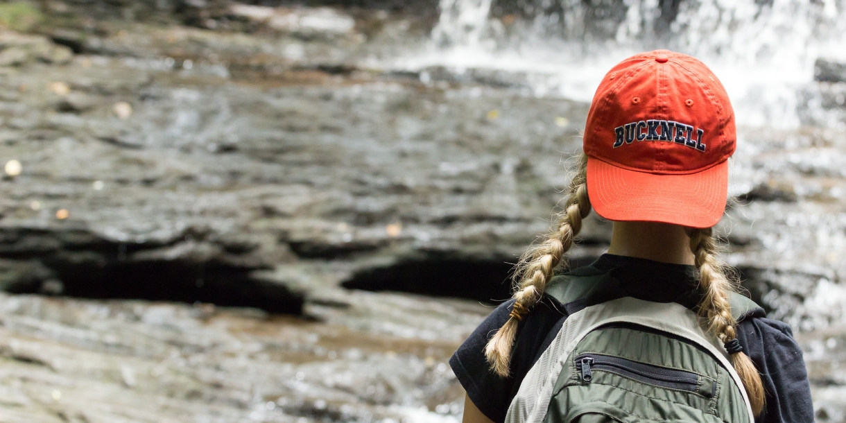 Student in front of a waterfall at Ricketts Glen