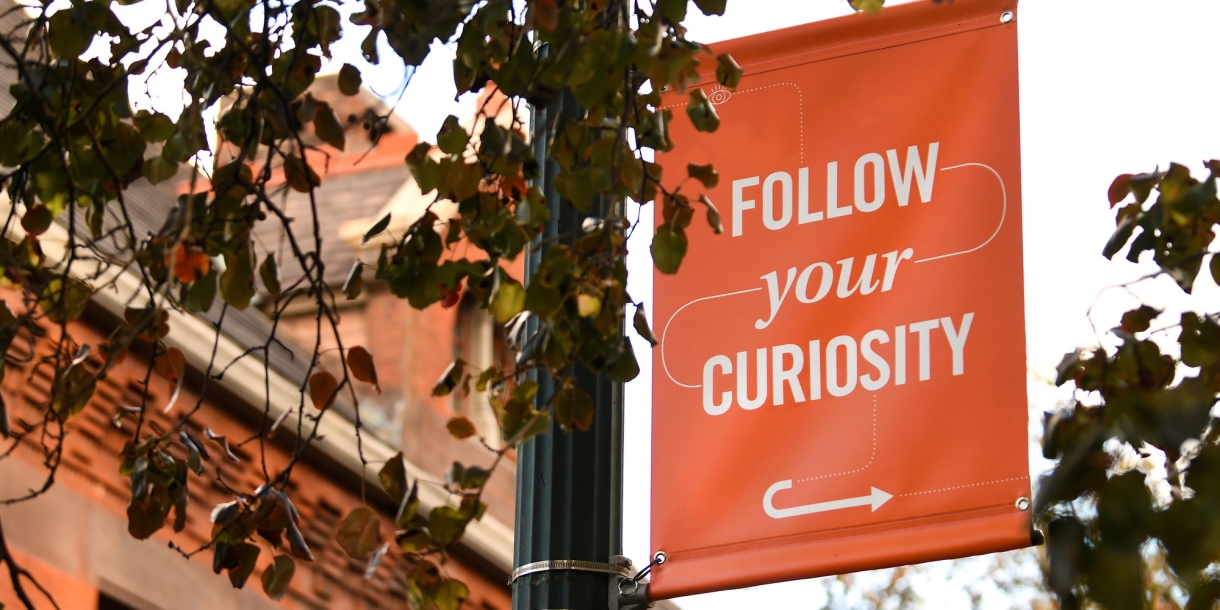 Follow Your Curiosity banner on campus
