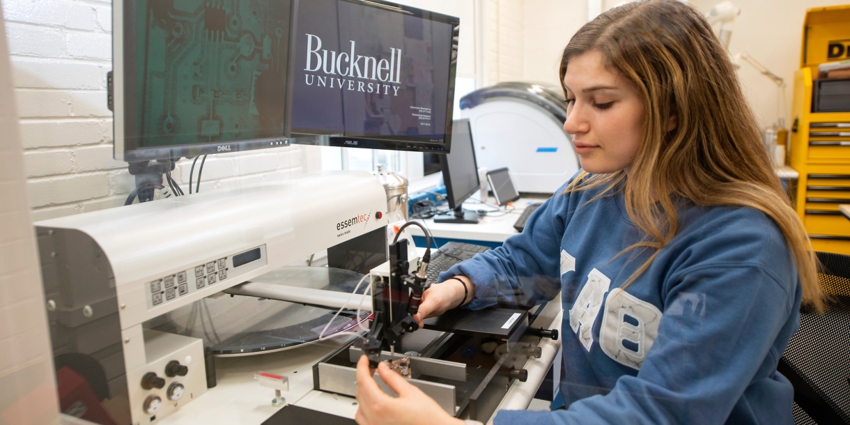 Student using a microscope in Maker-E