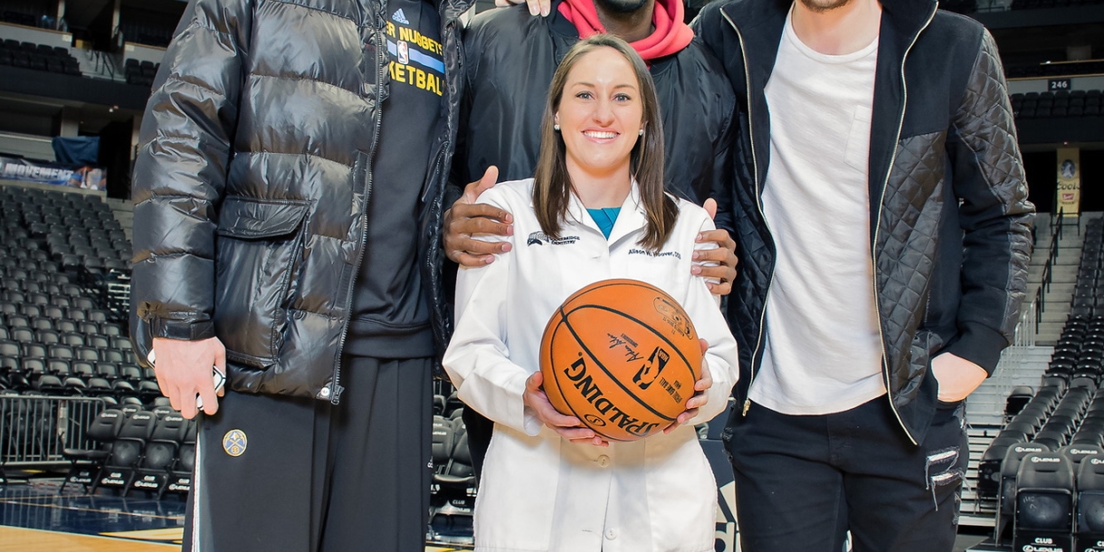 Alison Hoover with Denver Nuggets players