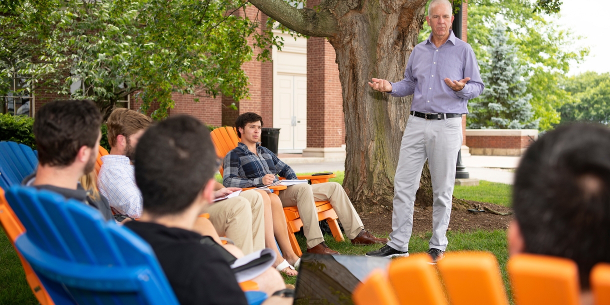 Professor Neil Boyd teaches a class to students on Malesardi Quad