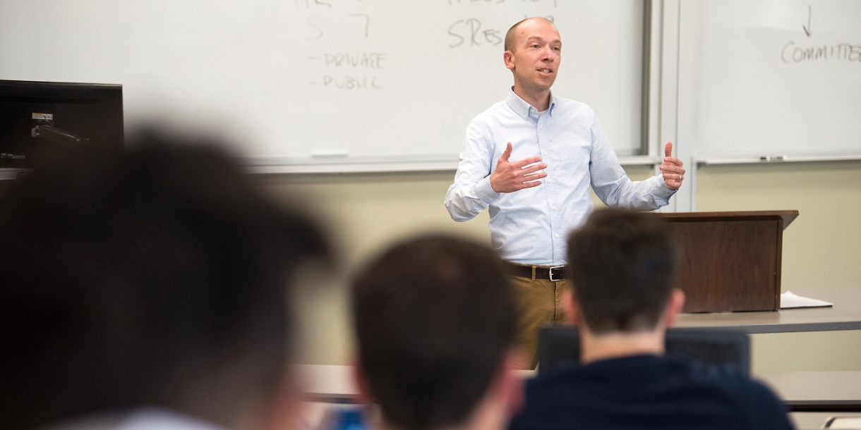 Professor teaching in front of a class