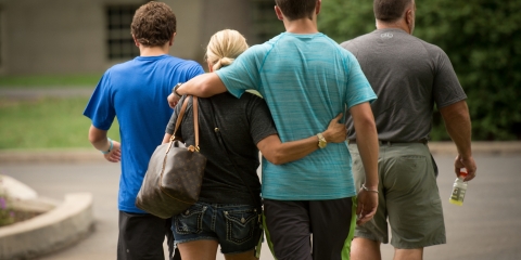 Parents walking with student