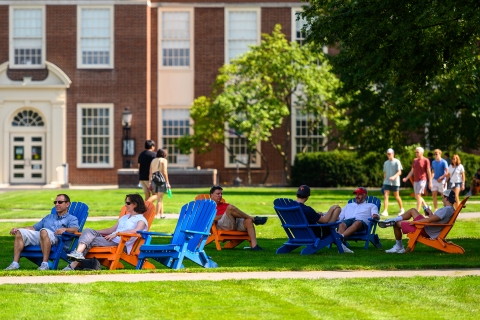 Families sitting in chairs on Malesardi Quad