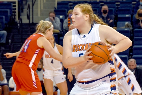 A still of a basketball player holding a ball preparing to pass