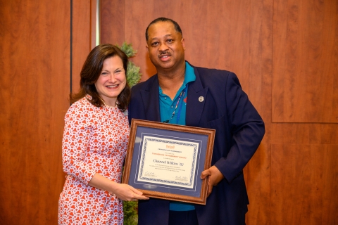 Christine (Zapotoczky) Kelleher &#039;91 presenting Channell Wilkins &#039;82 the  Service to Humanity Award.