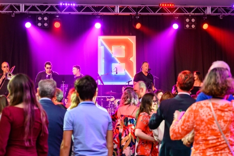 The Business performing at Bison Blast, people dancing