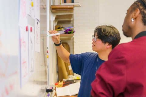 SBDC Engineering Students writing on a white board