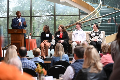 Napoleon Stephenson P&#039;24, VP of the Parents Board, addresses the student panelists during the President&#039;s Leadership Breakfast.